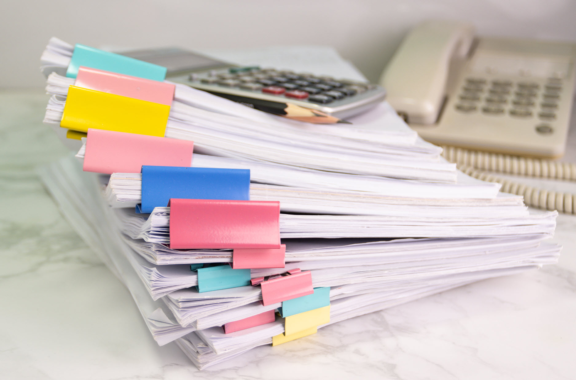 Organized financial and tax files secured with colorful document clips