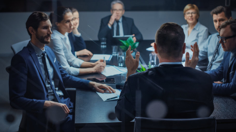 Business leaders meeting to review accounting information and plan company strategy